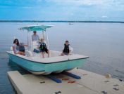 Family loading onto boat launch