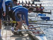 Rowers standing on a low profile dock