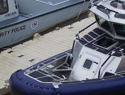 Police boats parked on floating dock
