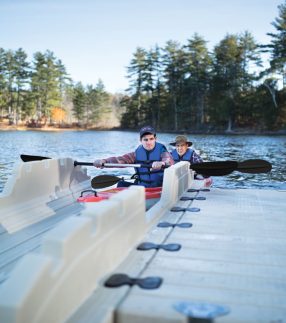 Man and father getting into EZ Launch® Residential Dock