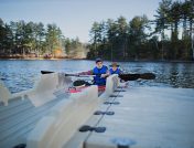 A father and son launch their kayak