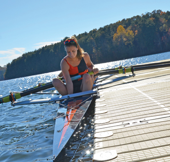 Woman about to go out on water in kayak