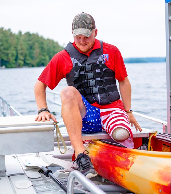 Disabled guy getting into kayak