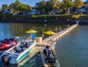 Boats and jet skis on floating dock sections