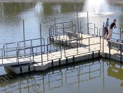 Wide angle view of floating dock with railings