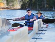 Father and son on kayak launch