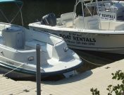 View of 4 boats attached to floating dock