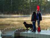 couple and dog on dock