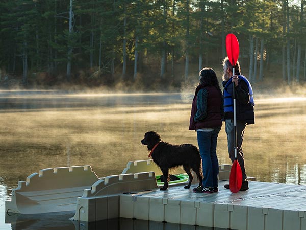 couple and dog on dock