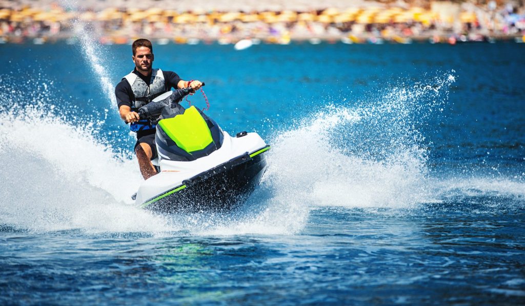 Man on green jet ski