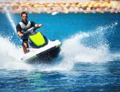 Man on green jet ski