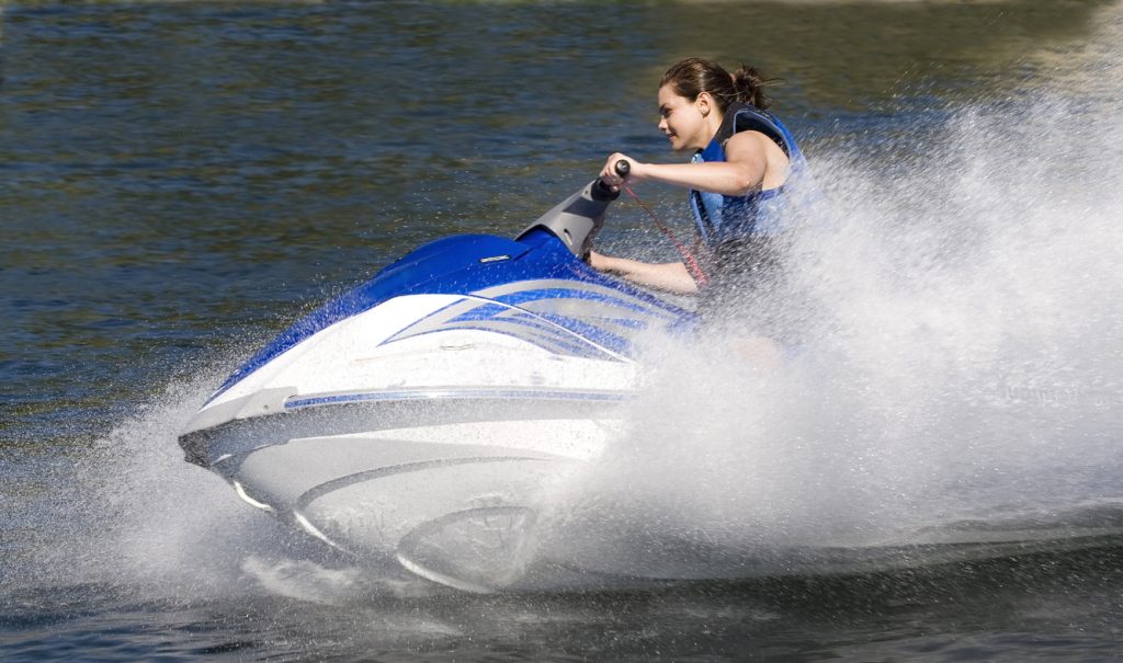 Girl on blue jet ski