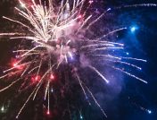 Fireworks display with red, white, blue, and gold colors