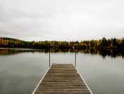 Scenic fall view of lake on wooden dock