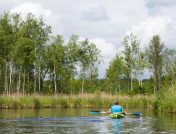 Man canoeing down a river