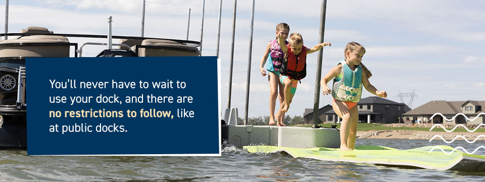 Children running happily off a private floating dock to the water