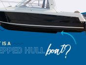 Black and white stepped hull boat on a blue and white background with "what is a stepped hull boat?" text underneath